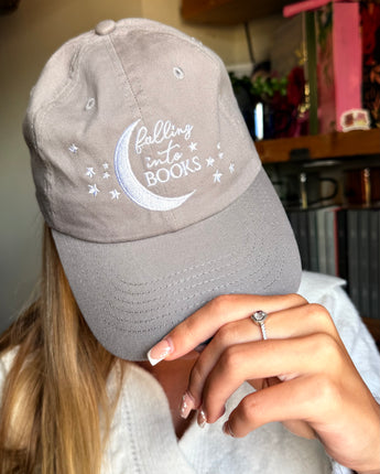 Falling into Books Baseball Cap