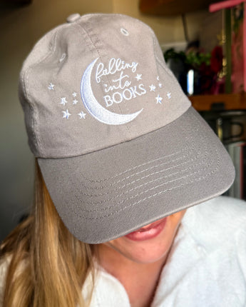 Falling into Books Baseball Cap